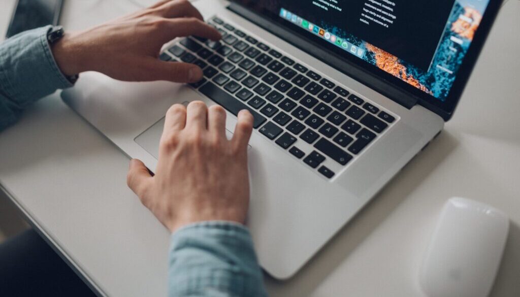 Štefan Štefančík / Unsplash.com person wearing long-sleeve top working on laptop