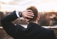 man in black long sleeve shirt wearing black watch