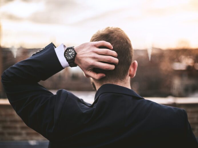 man in black long sleeve shirt wearing black watch