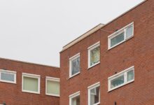 brown brick building with glass windows