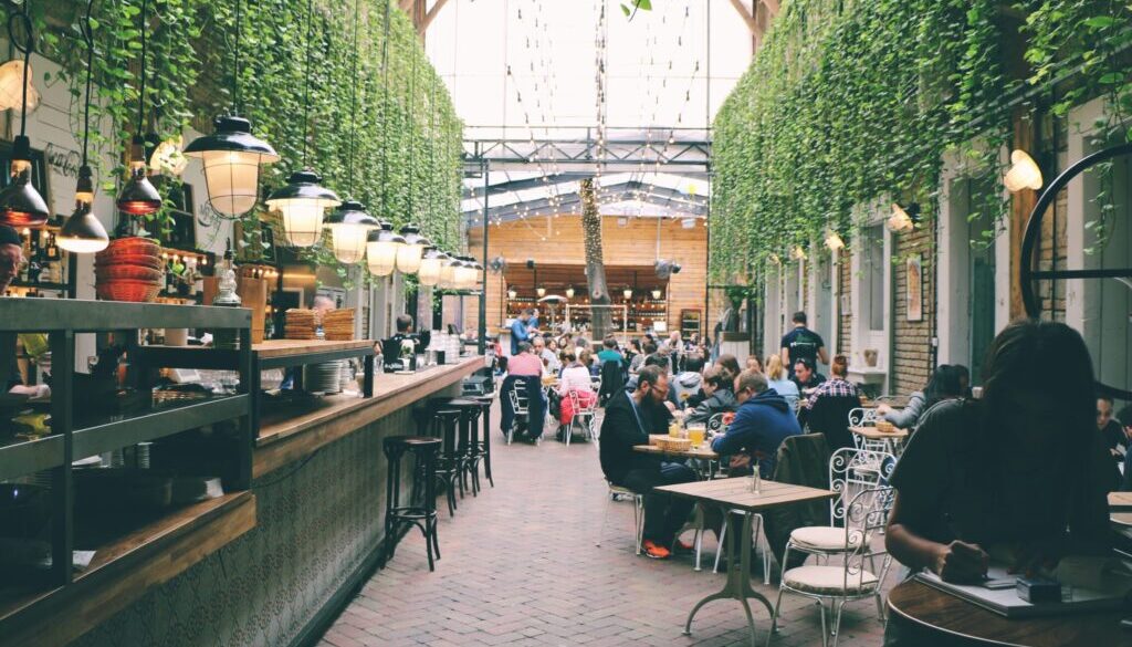 Petr Sevcovic / Unsplash.com people sitting inside restaurant tables