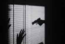 silhouette of person on window