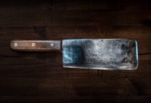 brown handle knife on brown wooden table