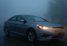 silver Hyundai sedan on gray concrete road