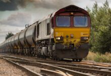yellow and black train on railways