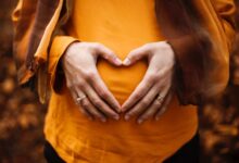 person touching stomach