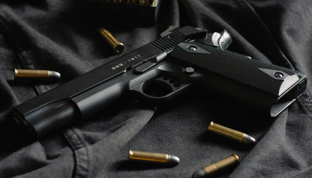 Thomas Def black semi automatic pistol on black textile