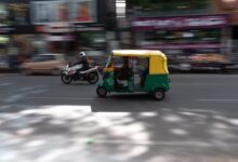 yellow auto-rickshaw
