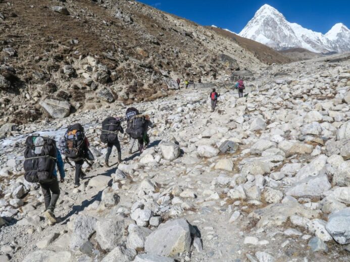 people carrying backpack