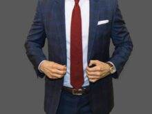 man in black suit jacket and red necktie