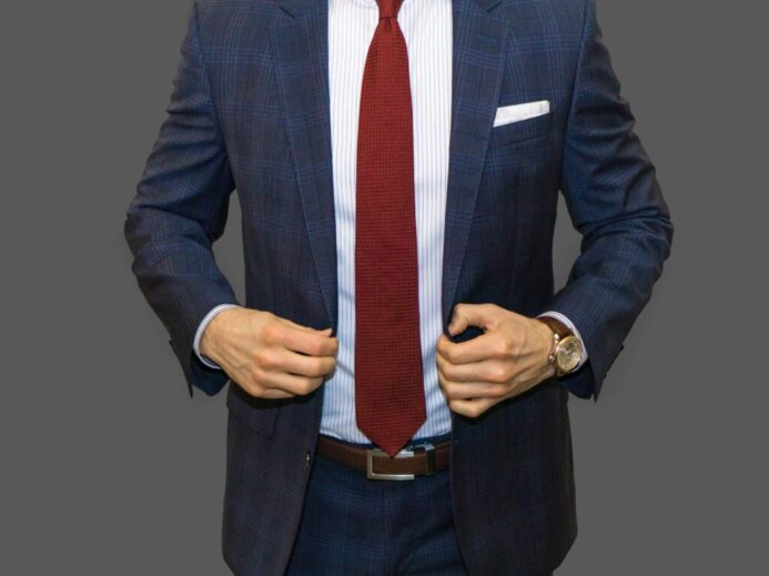 man in black suit jacket and red necktie