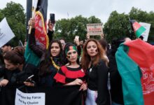 group of people holding banner