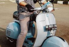 woman in blue and white floral long sleeve shirt and blue leggings riding on white and