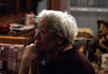 woman in black shirt wearing eyeglasses