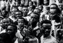 grayscale photo mass of people