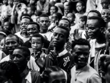 grayscale photo mass of people