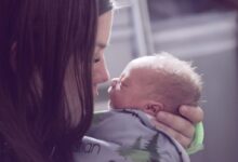 woman kissing baby