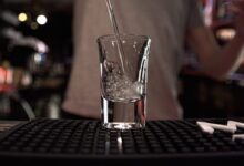 clear drinking glass with silver spoon