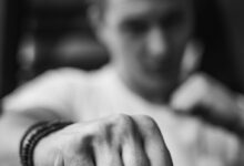 man with his arms clench