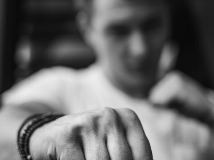 man with his arms clench