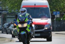 man in green helmet riding on yellow and black motorcycle during daytime
