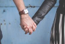 man and woman holding hands
