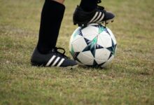 person playing soccer on field