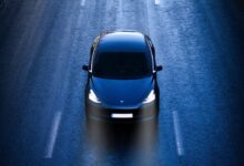 blue car on road during daytime