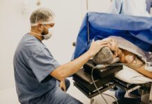 man lying on the hospital bed