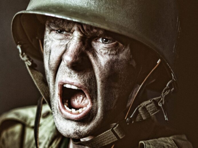 man in green zip up jacket wearing black helmet