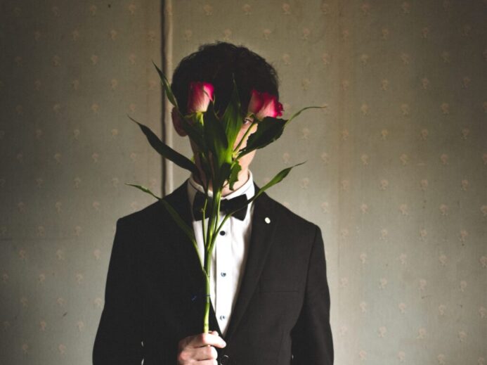 man holding red rose