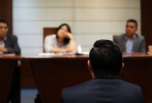 man in black shirt sitting beside woman in white shirt