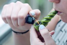 person holding lighting spoon pipe