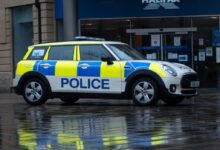 white and black police car on road