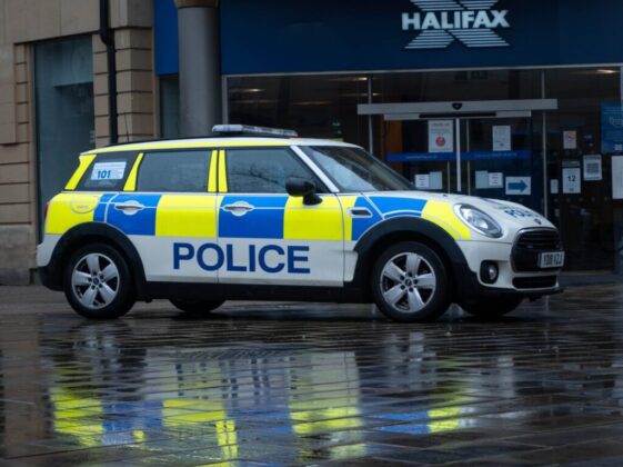 white and black police car on road
