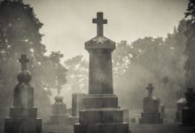 gray concrete cross on gray concrete blocks