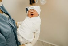 woman carrying baby