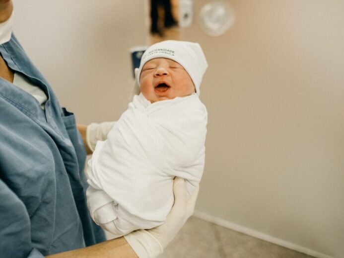 woman carrying baby