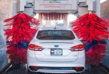white Ford vehicle on car wash shop