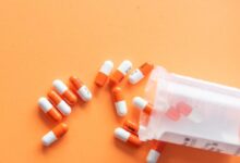 orange and white medication pill
