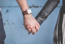 man and woman holding hands