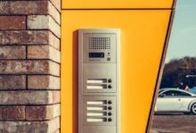 gray alarm system on yellow wall