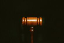brown wooden stand with black background