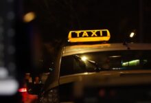 yellow taxi cab on road during night time