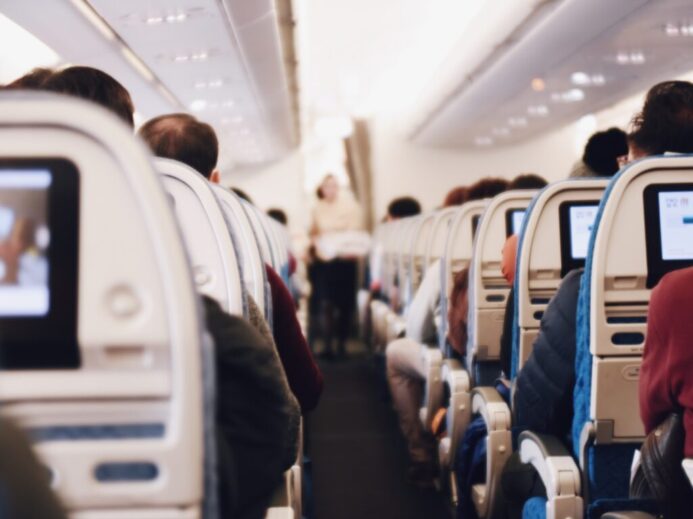 shallow focus photography of people inside of passenger plane