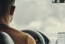 man driving vehicle