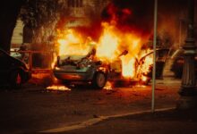 broken car covered with flame