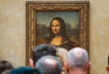 woman in black top standing near people