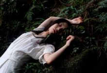 woman in white dress lying in white dress