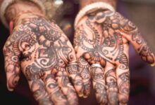 person showing hand tattoos
